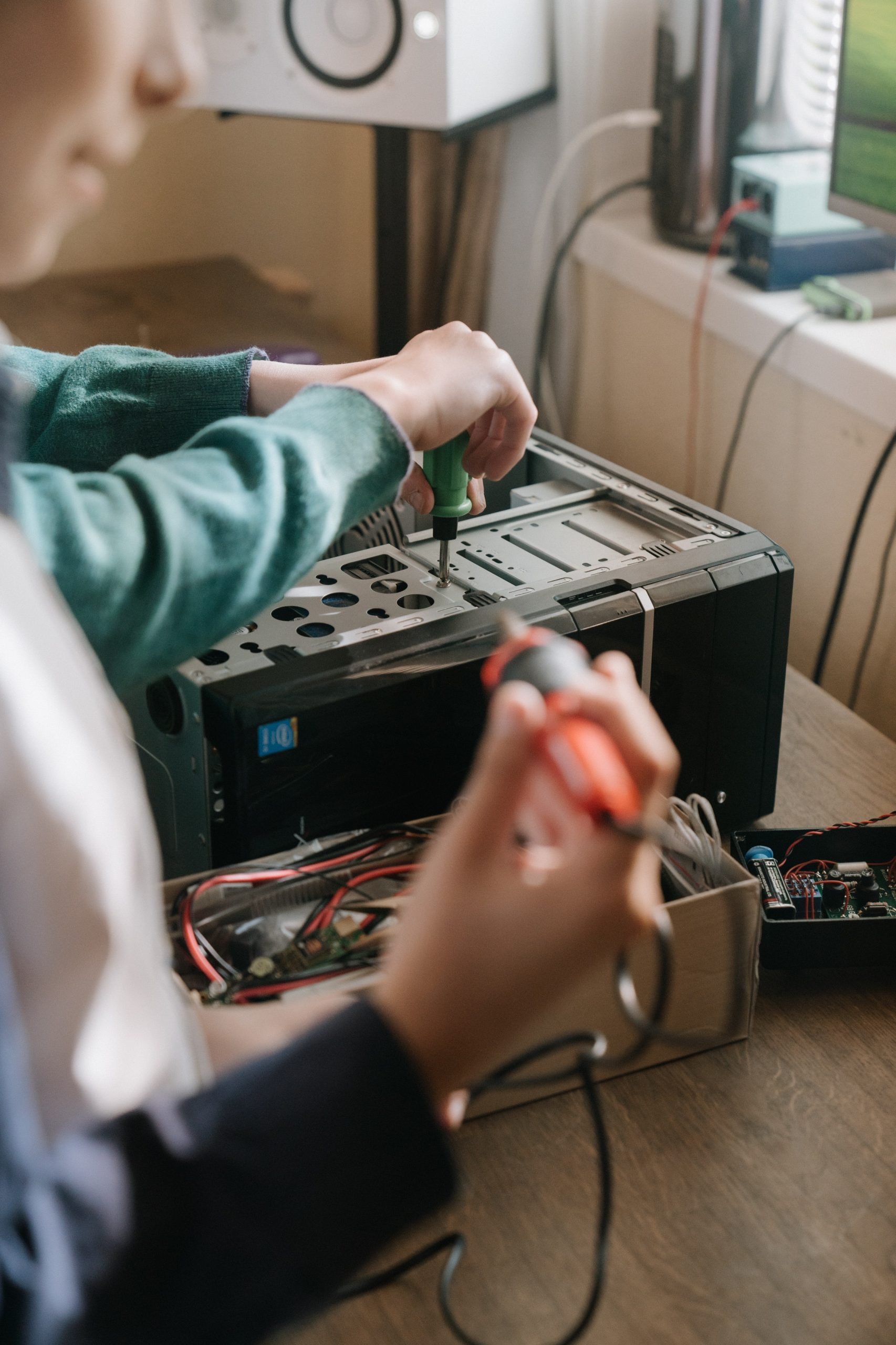 Kids assembling a server.