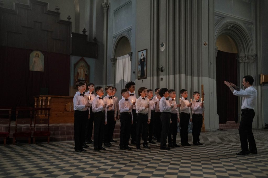 Understanding Openshift versions will take practice - and a divine intervention won't hurt, either. Photo credit: https://www.pexels.com/it-it/foto/persone-chiesa-cantando-cantanti-7569424/